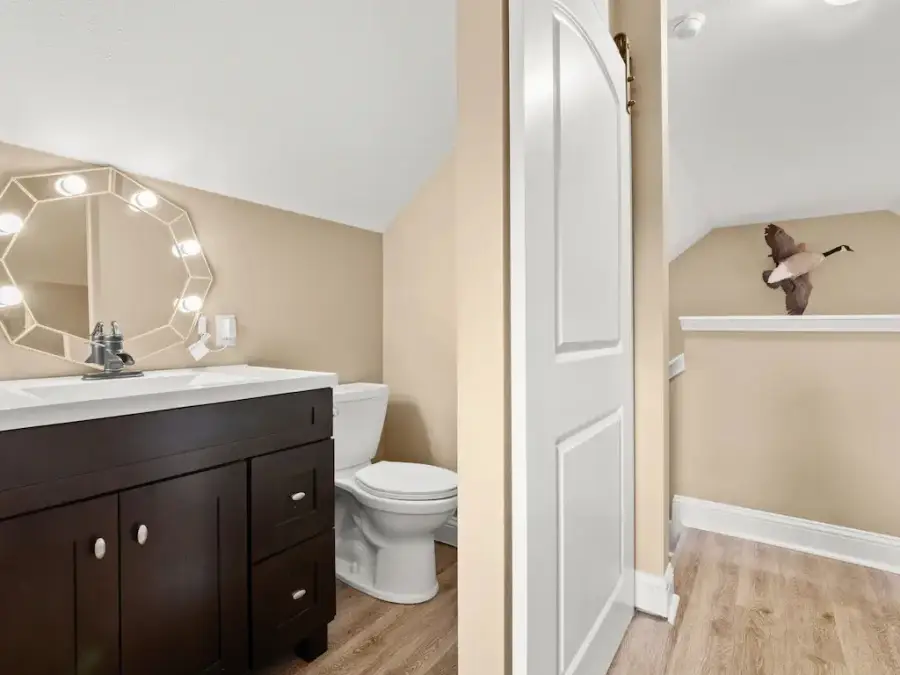 Bathroom 3 is a single lavatory and toilet.